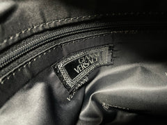 Vintage Gianni Versace duffle handbag in blue, yellow, green and other color fabric and black leather combination. 060810y1