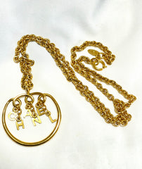 Vintage CHANEL golden long chain necklace with round logo letter dangling pendant top. Rare and adorable jewelry. 070204ac1