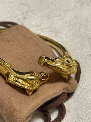 Vintage Hermes golden double horse head design bangle, bracelet. Beautiful classic jewelry from Hermes. 060220m