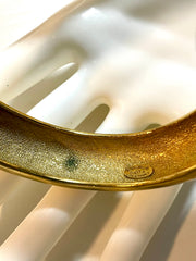 Vintage Chanel golden bangle with embossed black logo.  Must have gorgeous jewelry. 060810r1