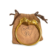 Vintage Hermes golden double horse head design bangle, bracelet. Beautiful classic jewelry from Hermes. 060220m