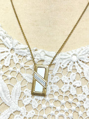 Vintage Christian Dior golden skinny chain necklace with logo embossed rectangular pendant top. 070131ys2