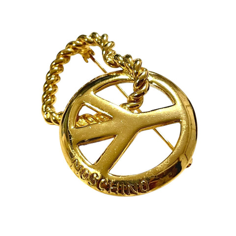 Vintage MOSCHINO golden twisted heart and Love & Peace design brooch. A chic and playful statement jewelry piece from the 1990s. 080825ac1