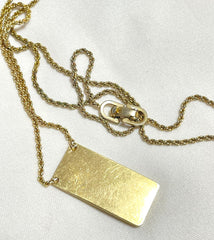 Vintage Christian Dior golden skinny chain necklace with logo embossed rectangular pendant top. 070131ys2