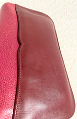 Vintage Cartier wine leather clutch bag with gold tone logo motif. Classic purse from must de Cartier Collection. 080114tr2