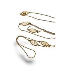 Vintage Christian Dior skinny golden chain necklace with gold and white oval CD charms. Classic Dior jewelry. Long necklace. 060130ac2
