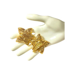 1990s. Vintage Christian Lacroix gold-tone star earrings. Heavy statement jewelry with a rich chocolate-inspired look. 080830ys1