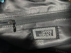 Vintage Gianni Versace duffle handbag in blue, yellow, green and other color fabric and black leather combination. 060810y1