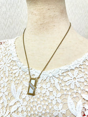 Vintage Christian Dior golden skinny chain necklace with logo embossed rectangular pendant top. 070131ys2