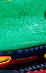 Vintage Celine genuine ostrich shoulder bag with gold tone chains and red, orange, blue, green, and yellow patchwork design. 050410ac1