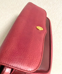 Vintage Cartier wine leather clutch bag with gold tone logo motif. Classic purse from must de Cartier Collection. 080114tr2
