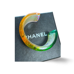 Vintage Chanel plastic aurora resin cuff link bangle/ bracelet with golden logo. Must have gorgeous jewelry. 060904br