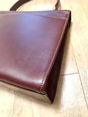Vintage Cartier wine leather handbag with gold-tone closure. les must de cartier collection. Made in Italy. Classic and elegant. 080114tr4