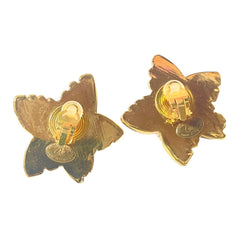1990s. Vintage Christian Lacroix gold-tone star earrings. Heavy statement jewelry with a rich chocolate-inspired look. 080830ys1