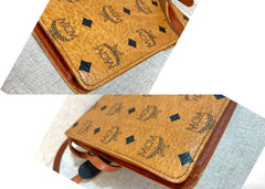 1990s. Vintage MCM brown monogram shoulder bag in envelop design. Designed by Michael Cromer. Can be a clutch bag too. 061217ac2