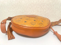 Vintage MCM brown monogram round Suzy Wong shoulder bag with brown leather trimmings. Designed by Michael Cromer. Unisex. 070325ac4