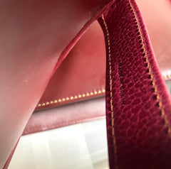 Vintage Cartier wine leather clutch bag with gold tone logo motif. Classic purse from must de Cartier Collection. 080114tr2