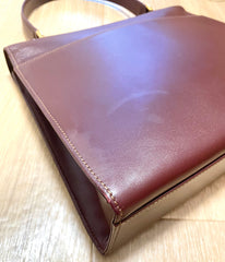 Vintage Cartier wine leather handbag with gold-tone closure. les must de cartier collection. Made in Italy. Classic and elegant. 080114tr4