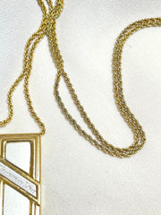 Vintage Christian Dior golden skinny chain necklace with logo embossed rectangular pendant top. 070131ys2