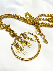 Vintage CHANEL golden long chain necklace with round logo letter dangling pendant top. Rare and adorable jewelry. 070204ac1