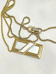 Vintage Christian Dior golden skinny chain necklace with logo embossed rectangular pendant top. 070131ys2