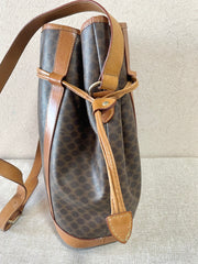 Vintage Celine hobo bucket shoulder bag in classic brown triomphe pattern with leather straps. 070218ys8