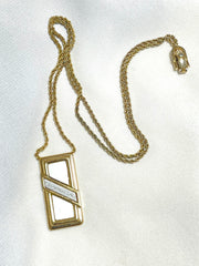 Vintage Christian Dior golden skinny chain necklace with logo embossed rectangular pendant top. 070131ys2