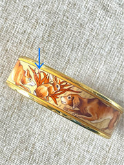 Vintage HERMES gold and brown tone and cloisonné/enamel bangle with rabbit, dog, and fox design. 070310ac2