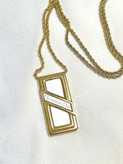 Vintage Christian Dior golden skinny chain necklace with logo embossed rectangular pendant top. 070131ys2