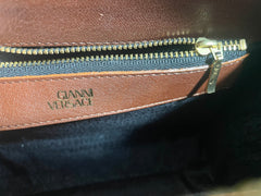 Vintage Gianni Versace brown leather wristlet, purse clutch, case bag with its iconic golden sunburst charms. Unisex bag. 061027y1