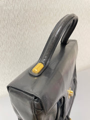 Vintage Bally black leather retro pop design bag, business purse with gold tone drawstrings and unique flap cut design.  Unisex use. 160315