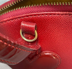 Vintage Christian Lacroix red patent enamel and leather bolide bag with golden logo zipper charm. Comes with shoulder strap. 0403172