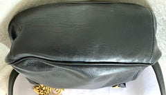 Vintage Moschino black leather shoulder bag with golden cute dangling charms. Heart, safety pin, trumpet, sacks, and guitar. 050725