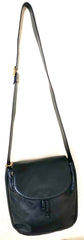 Vintage Moschino black leather shoulder bag with golden cute dangling charms. Heart, safety pin, trumpet, sacks, and guitar. 050725