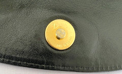 Vintage Moschino black leather shoulder bag with golden cute dangling charms. Heart, safety pin, trumpet, sacks, and guitar. 050725