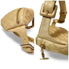 Vintage CHANEL beige lamb leather waist bag, fanny pack with double buckle belt and a golden dangling CC charm. Size 28"- 33". 051205ac1