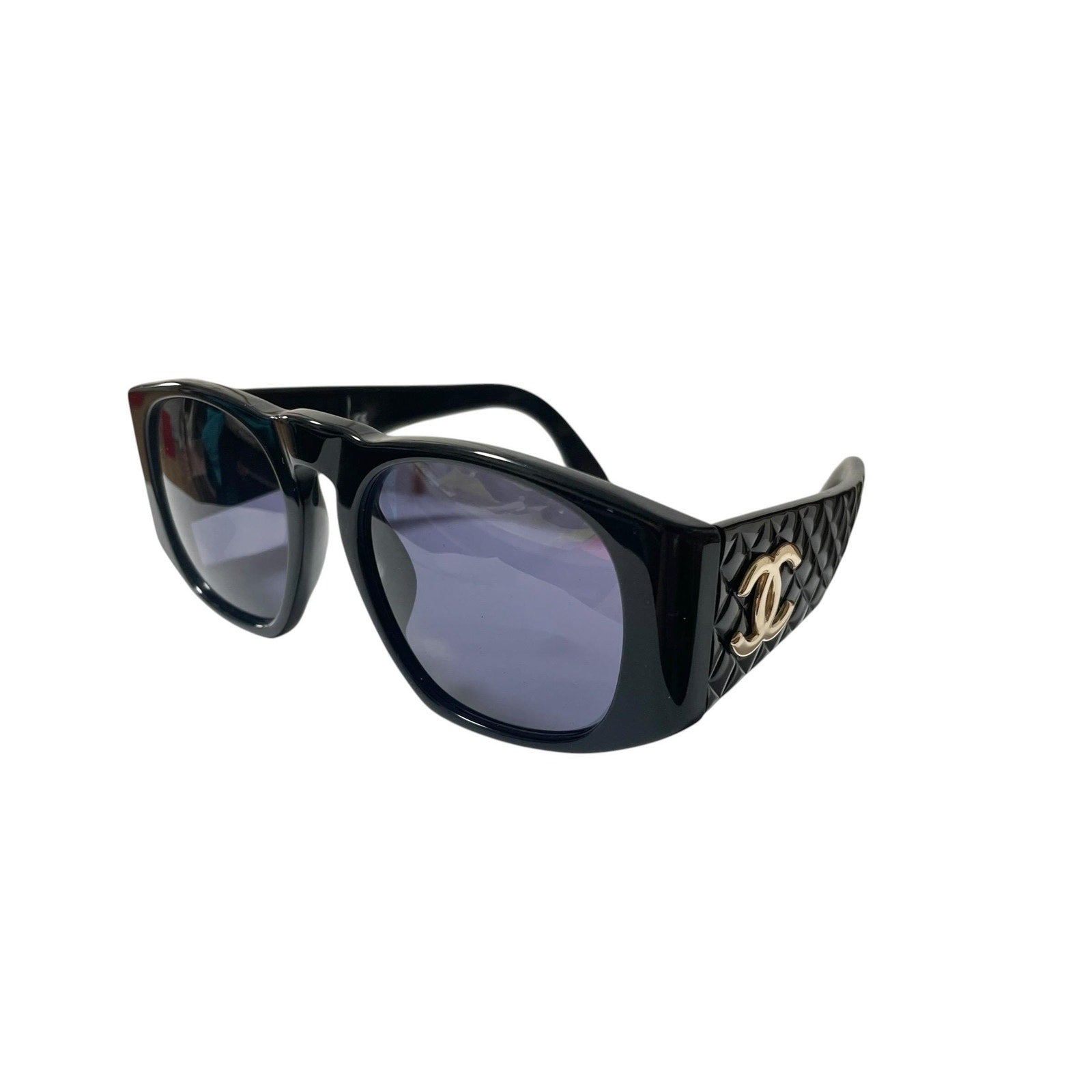 Vintage CHANEL black frame sunglasses with large CC motifs and matelasse at sides. Mod and chic eyewear you must get. 080915ys1