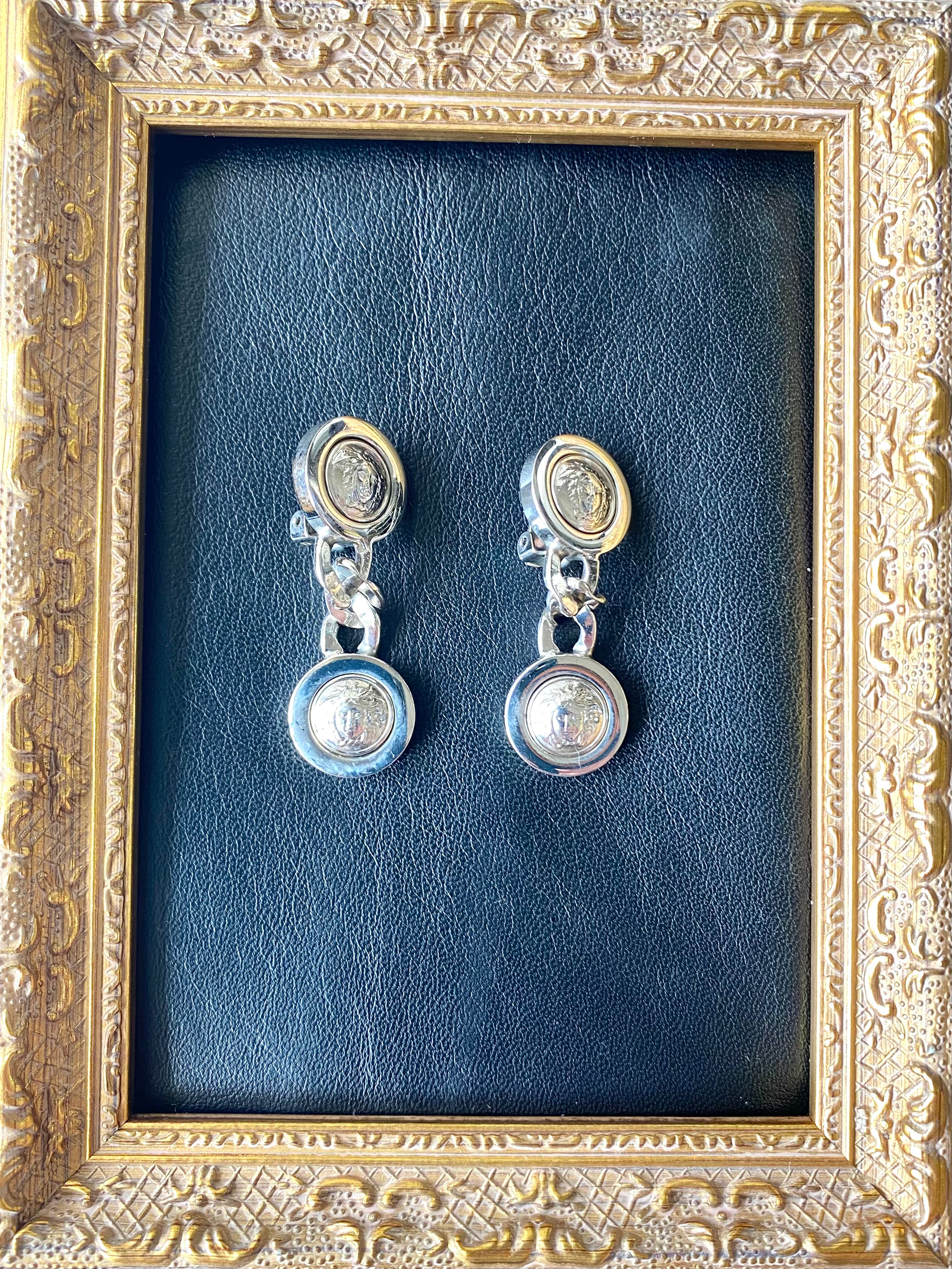 Vintage Gianni Versace silver dangle earrings with medusa faces and chain motif. Must have Lady Gaga style jewelry piece. 050601ya2