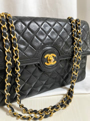80's vintage Chanel black 2.55 shoulder bag with circle CC  flap design. Rare piece from the era. 0410283
