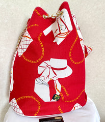 Vintage CHANEL red and white canvas large hobo shoulder bag with supermodel print and CC charm. Mademoiselle. 0407231