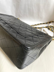 80's vintage Chanel black 2.55 shoulder bag with circle CC  flap design. Rare piece from the era. 0410283
