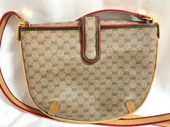 Vintage Gucci GG monogram shoulder bag with red and green webbing color convo shoulder bag. Golden and silver GG motif on the flap. 0411273