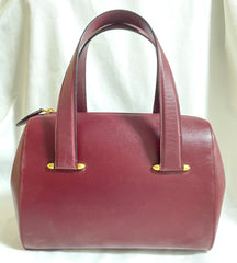 Vintage Cartier classic wine, bordeaux leather handbag purse with bullet design gold hardware at handles. Must de Cartier. 0408171