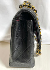 80's vintage Chanel black 2.55 shoulder bag with circle CC  flap design. Rare piece from the era. 0410283