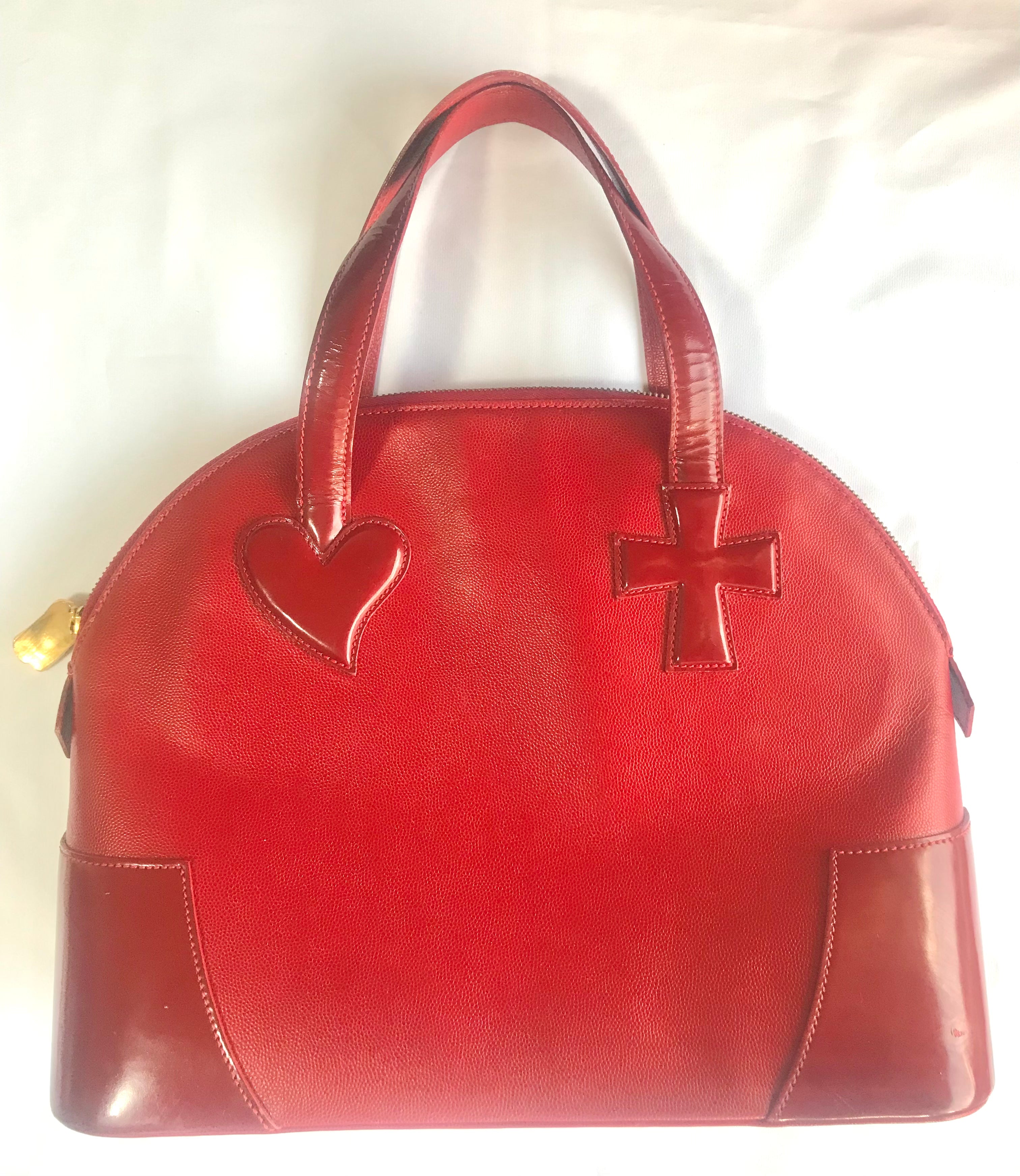 Vintage Christian Lacroix red patent enamel and leather bolide bag with golden logo zipper charm. Comes with shoulder strap. 0403172