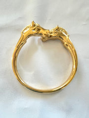 Vintage Hermes golden double horse head design bangle, bracelet. Beautiful classic jewelry from Hermes. 050120an8