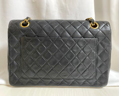 80's vintage Chanel black 2.55 shoulder bag with circle CC  flap design. Rare piece from the era. 0410283