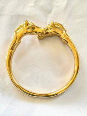 Vintage Hermes golden double horse head design bangle, bracelet. Beautiful classic jewelry from Hermes. 050120an8