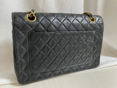 80's vintage Chanel black 2.55 shoulder bag with circle CC  flap design. Rare piece from the era. 0410283