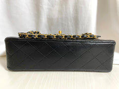 80's vintage Chanel black 2.55 shoulder bag with circle CC  flap design. Rare piece from the era. 0410283